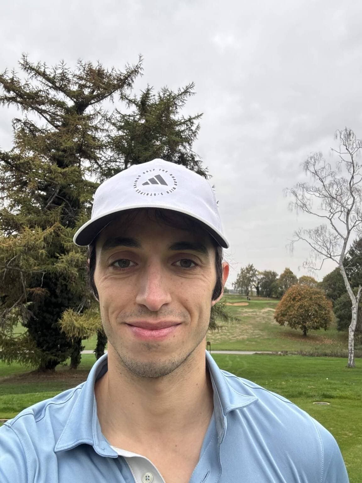 Portrait of James Tugwell on a golf course